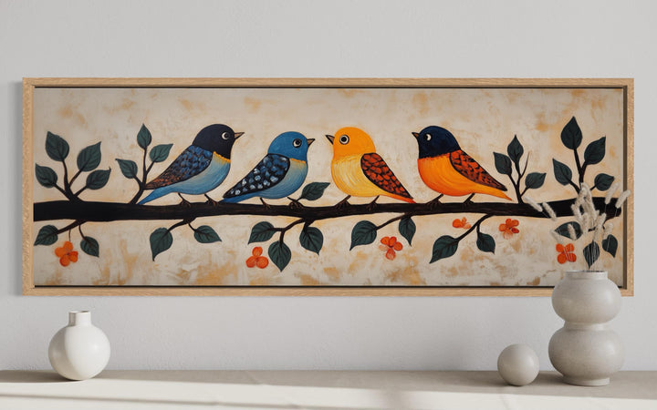 Folk style long narrow canvas print featuring four colorful birds perched on a branch.