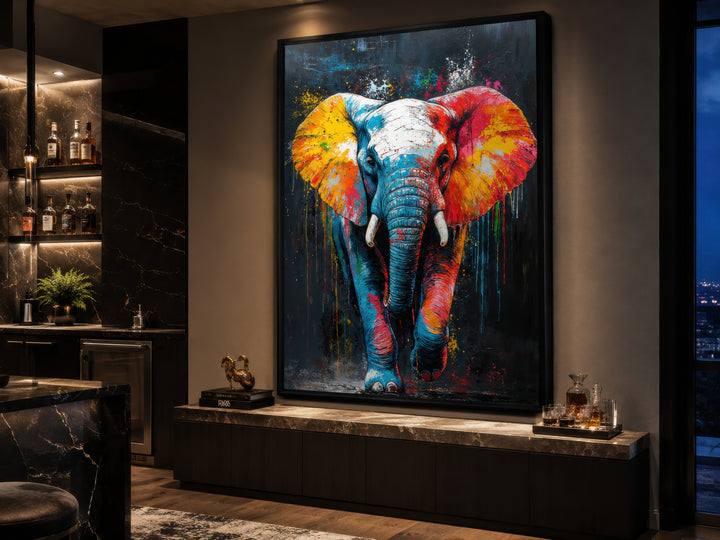 Large framed canvas wall art featuring a colorful graffiti-style elephant in a modern living room.