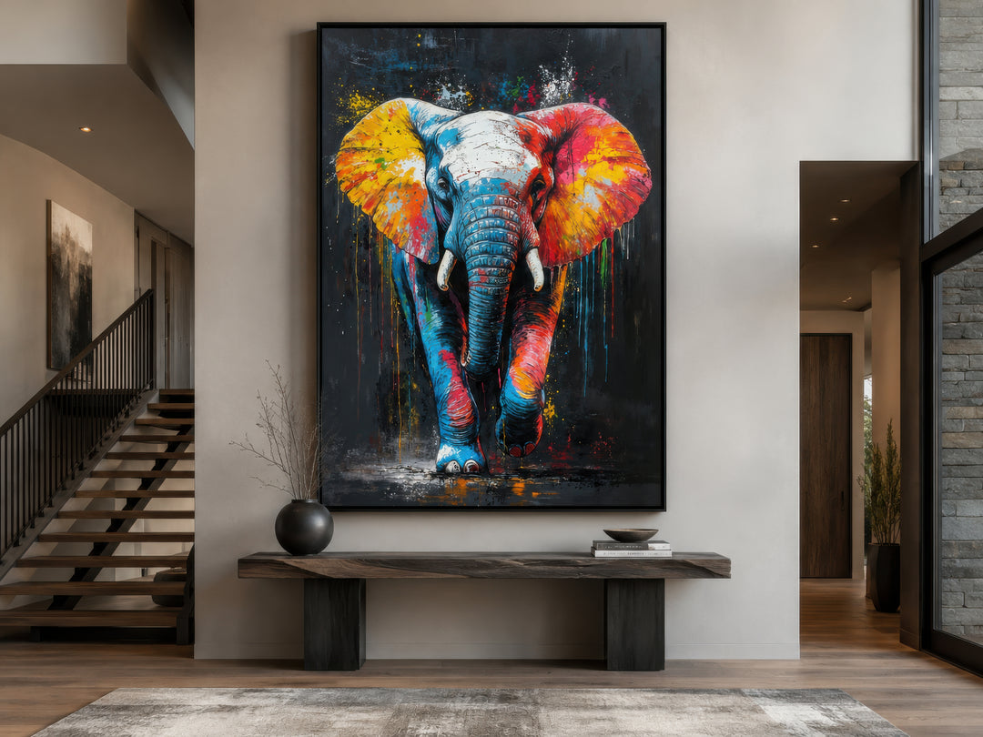 Colorful graffiti elephant framed canvas wall art displayed above a wooden bench in a modern room.
