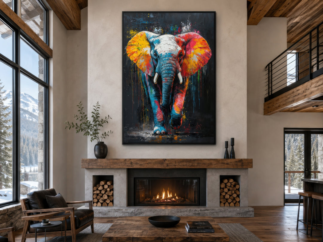 Colorful graffiti elephant framed canvas wall art hanging above a fireplace in a modern living room.