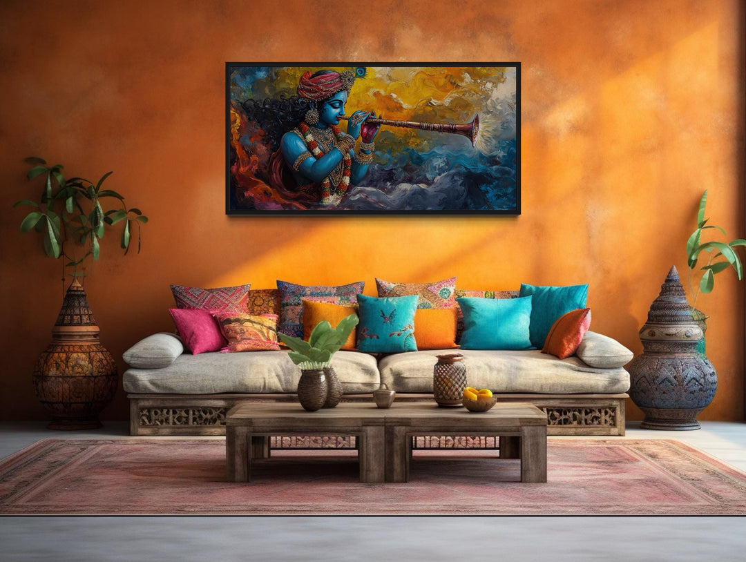 Colorful Krishna playing flute framed horizontal canvas wall art above a sofa in a vibrant room.