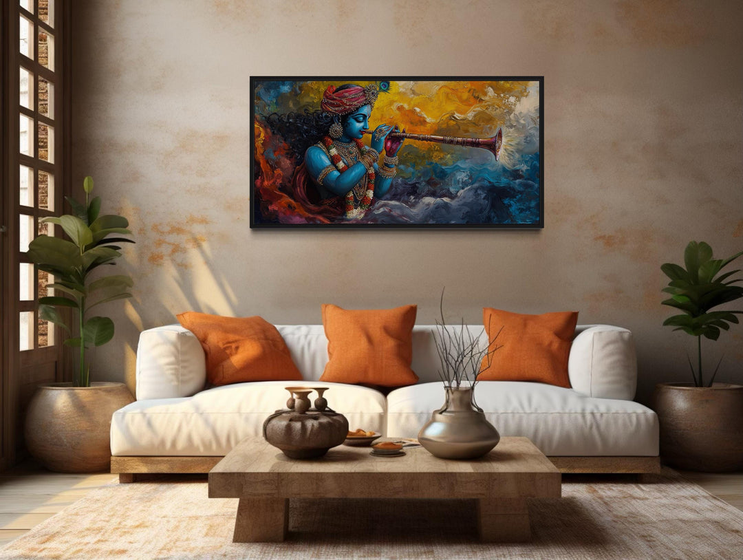 Colorful Krishna playing flute framed horizontal canvas wall art above a white sofa in a living room