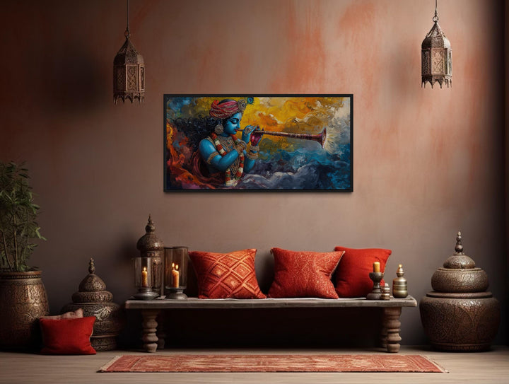 Colorful Krishna playing flute framed horizontal canvas wall art in a warm, traditional room.