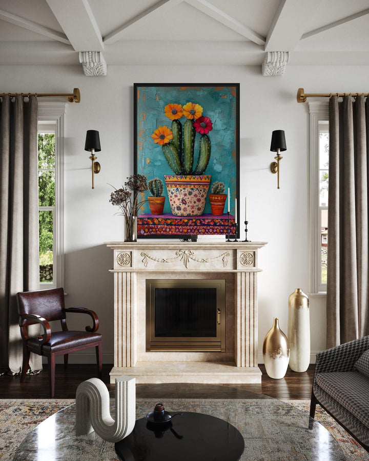 Colorful Mexican blooming cactus framed canvas wall art above a fireplace in a living room.