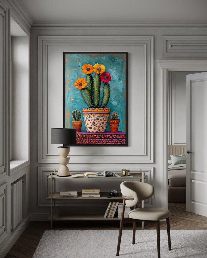 Colorful Mexican blooming cactus framed canvas wall art hanging in a modern living room.
