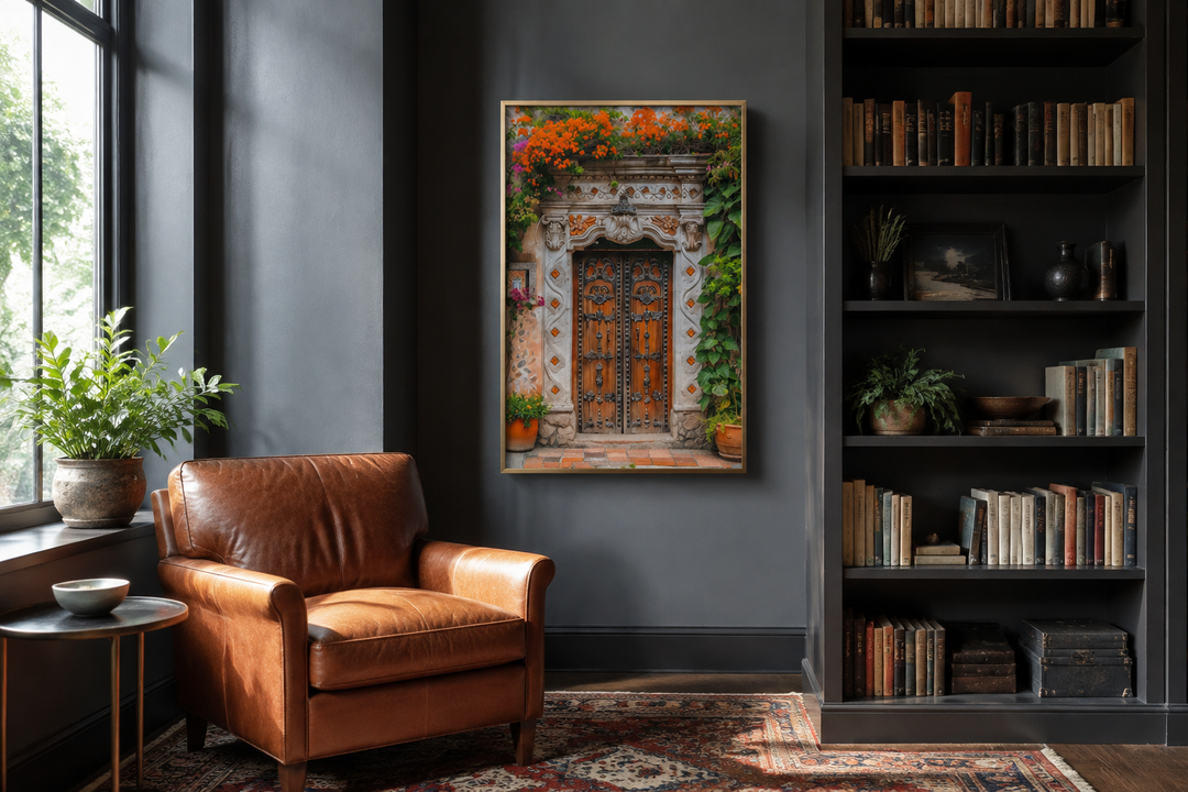 Colorful Mexican door painting framed canvas wall art in a dark gray room with a leather chair.
