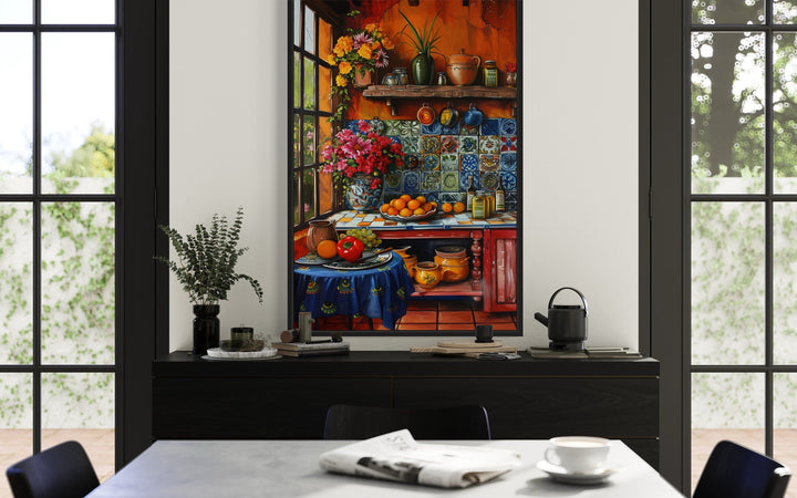 Colorful Mexican kitchen framed canvas wall art above a black sideboard in a modern dining room.