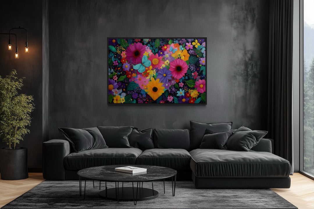 Colorful purple floral heart wall art with butterflies on a dark wall above a black sectional sofa.