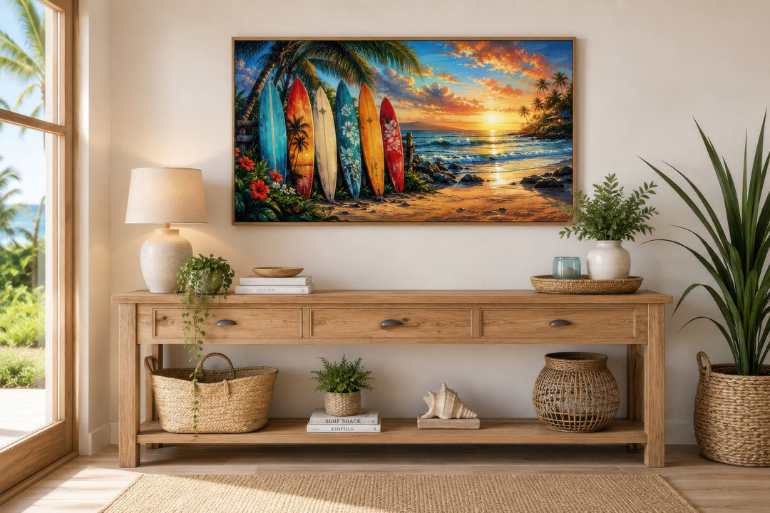 Colorful surfboards on a beach at sunset framed canvas wall art above a wooden console table.