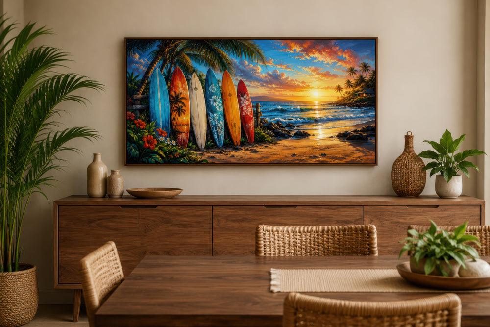 Colorful surfboards on a sunset beach framed canvas wall art above a wooden sideboard.