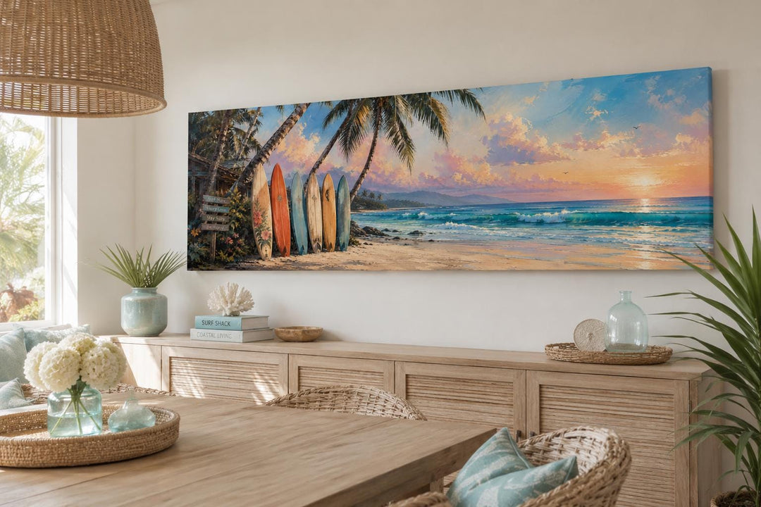 Horizontal canvas wall art of colorful surfboards on a tropical beach at sunset.