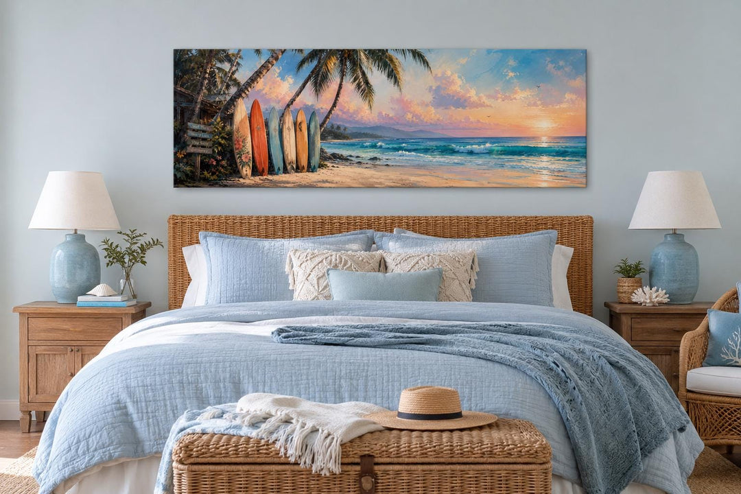 Colorful surfboards on a tropical beach at sunset horizontal canvas wall art above a bed.