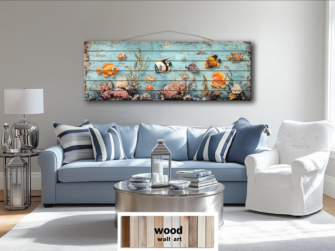 A long, narrow distressed wood wall art piece featuring colorful tropical fish and a coral reef.