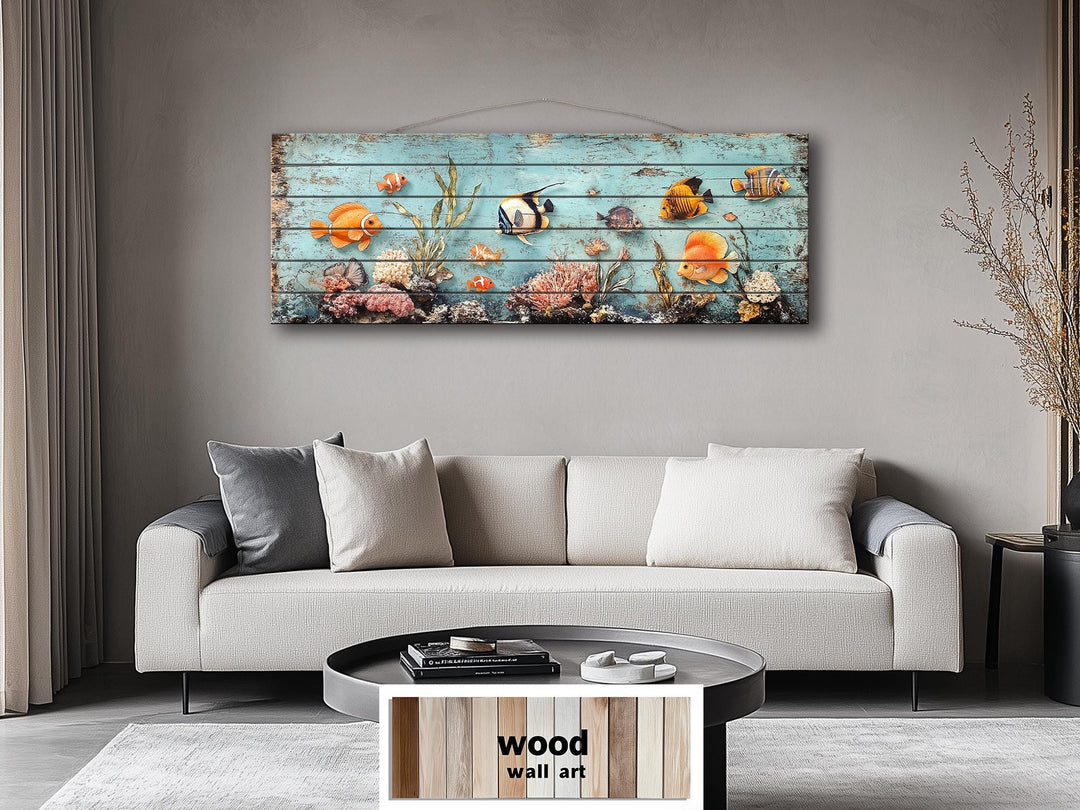 A long narrow wood wall art piece featuring colorful tropical fish and coral on a blue background.