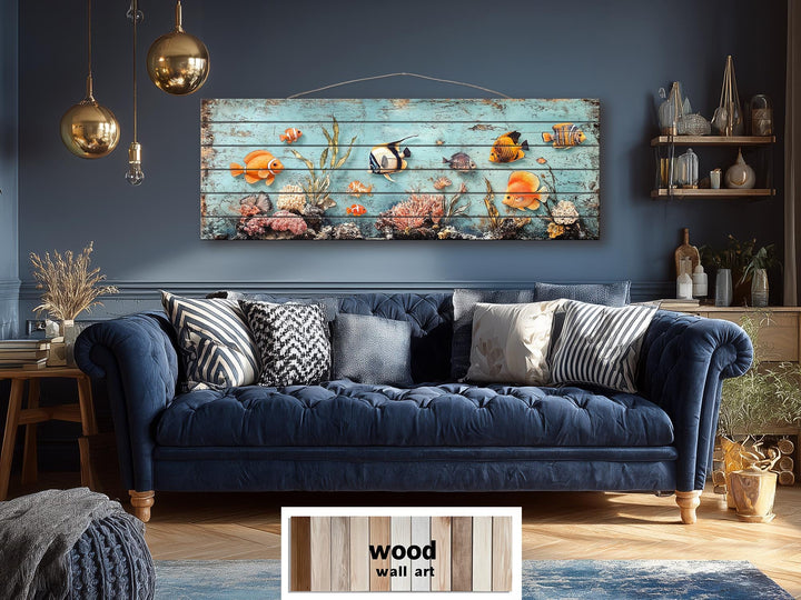 A long narrow wood wall art piece featuring colorful tropical fish and coral on a blue background.