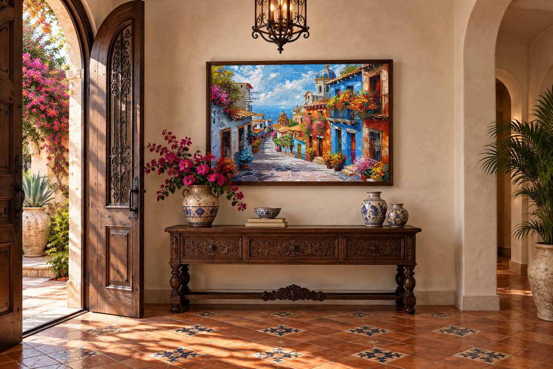 Colorful Mexican village street framed canvas wall art hanging above a dark wood console table.