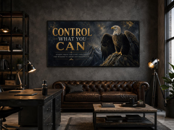 Motivational bald eagle canvas art with gold text 'Control What You Can' in a dark office setting.