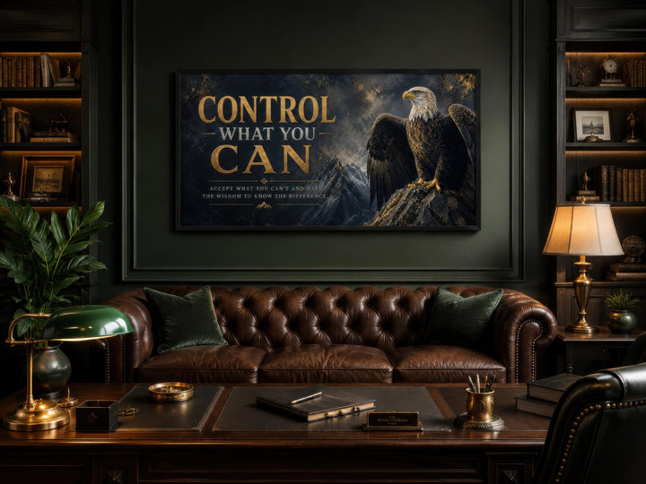 Motivational bald eagle canvas art with gold text Control What You Can in a dark office setting.