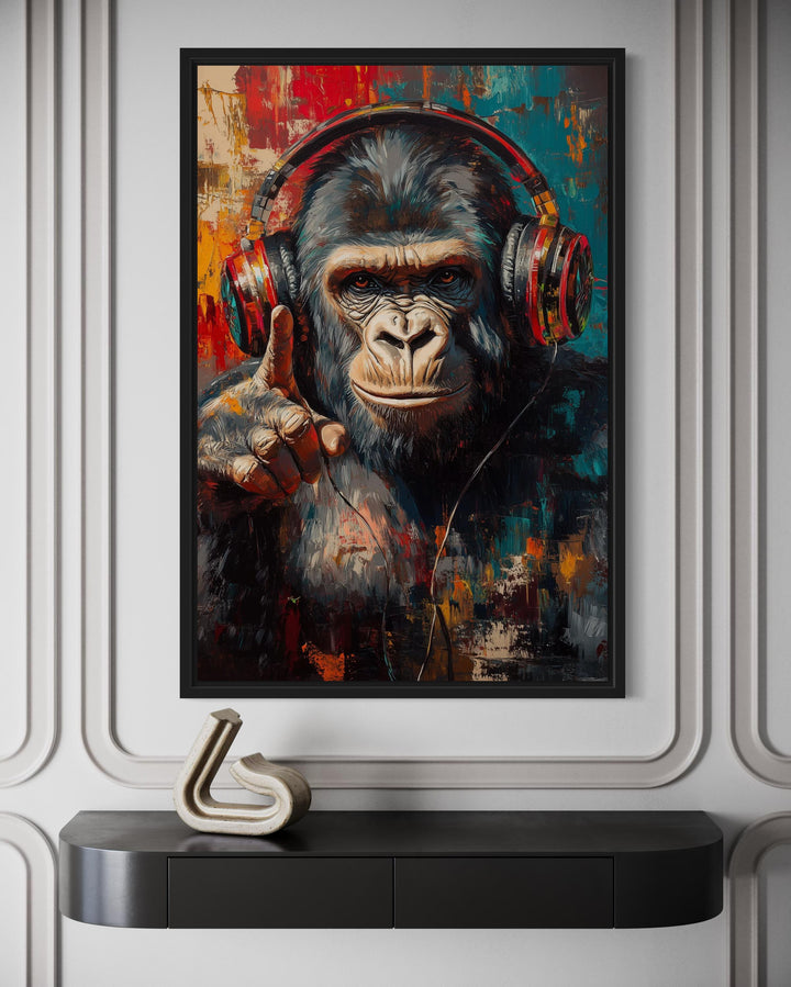 Cool DJ gorilla canvas wall art with red headphones in a modern room above a black console table.