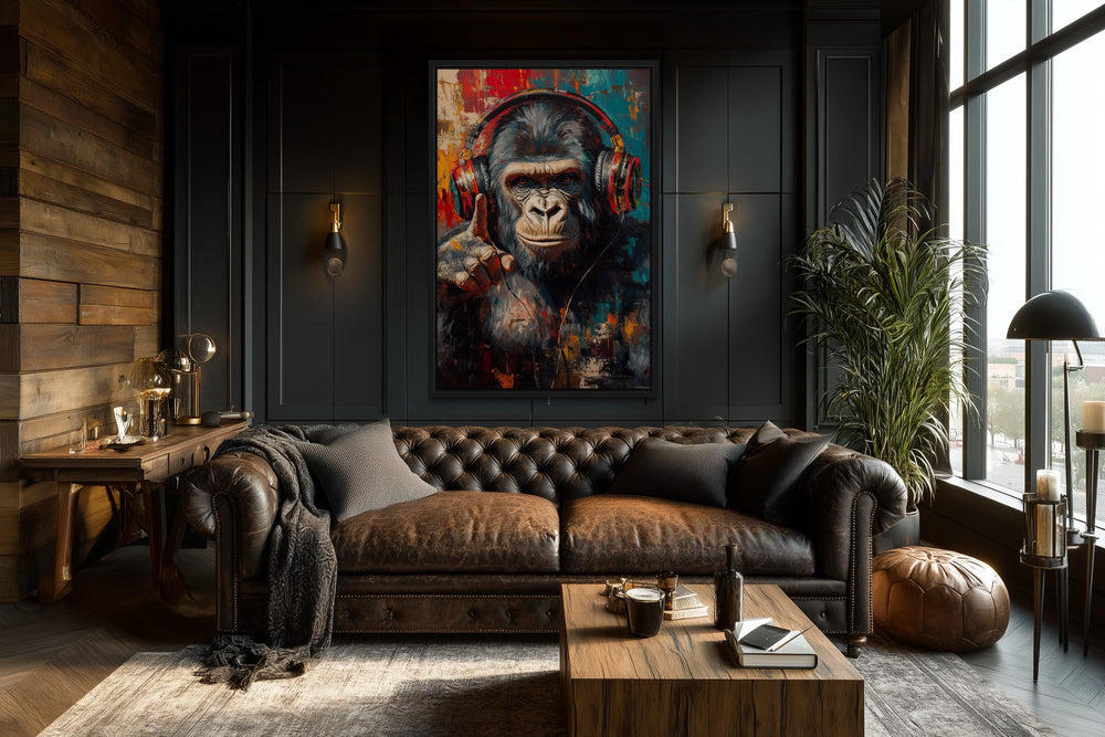 Cool DJ gorilla with headphones canvas wall art in a dark, modern living room above a leather sofa.