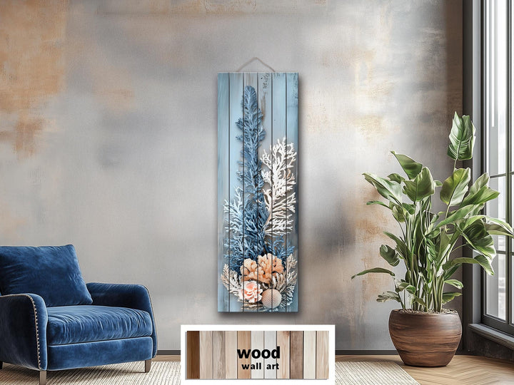 Narrow vertical coastal coral wall art printed on distressed blue and white wood planks.