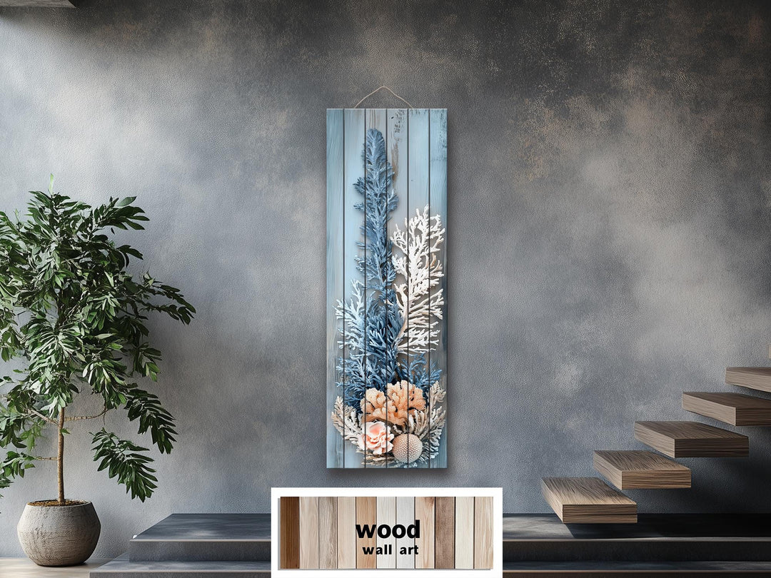 Narrow vertical coastal coral wall art printed on distressed wood with blue, white, and beige tones.