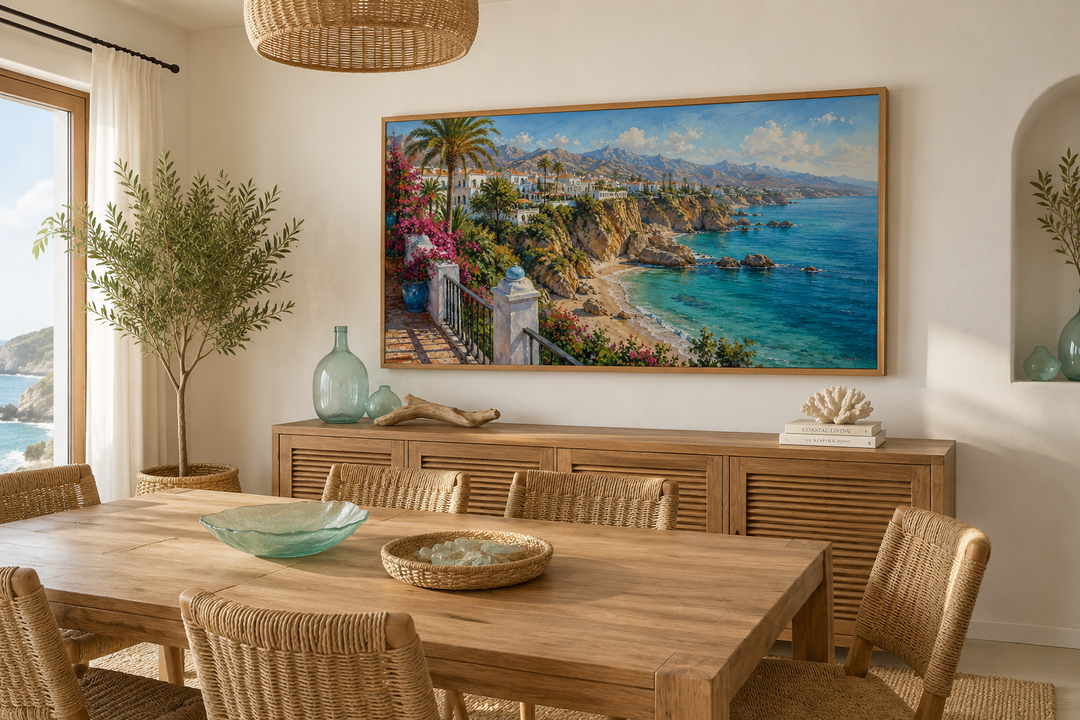 Framed canvas wall art of a sun-drenched Spanish coastal village above a blue Mediterranean sea.