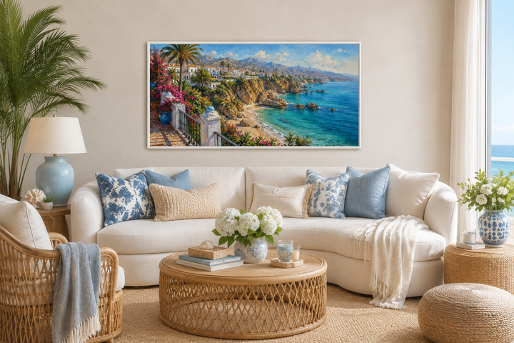 Costa Del Sol Mediterranean coastal village framed canvas art above a white sofa in a coastal room.