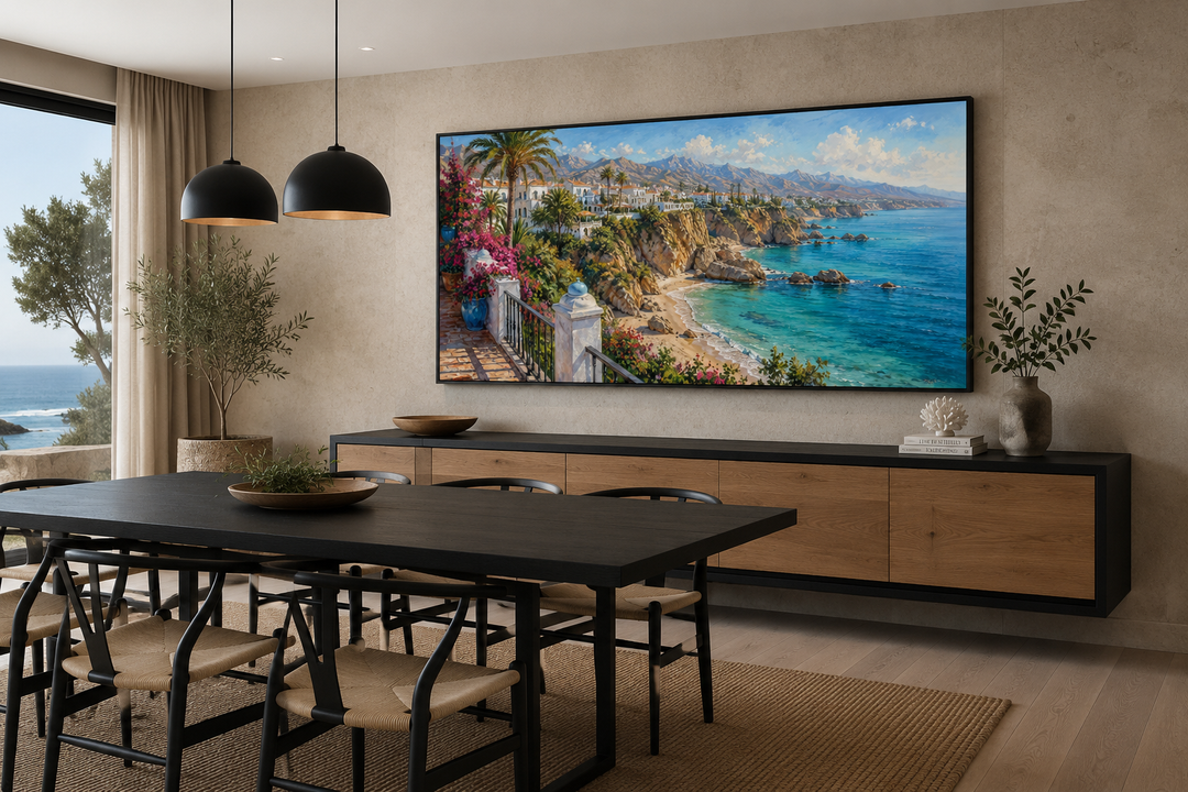 Costa Del Sol Mediterranean coastal village painting in a black frame above a dining room sideboard.