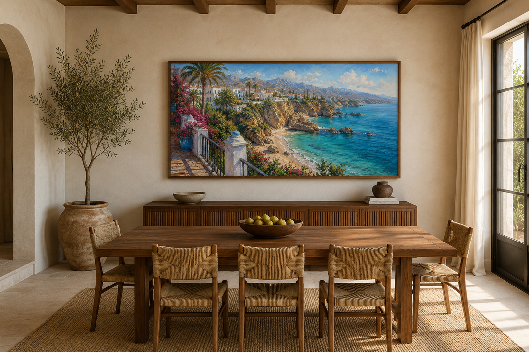 Costa Del Sol framed canvas wall art showing a Mediterranean coastal village above a dining table.