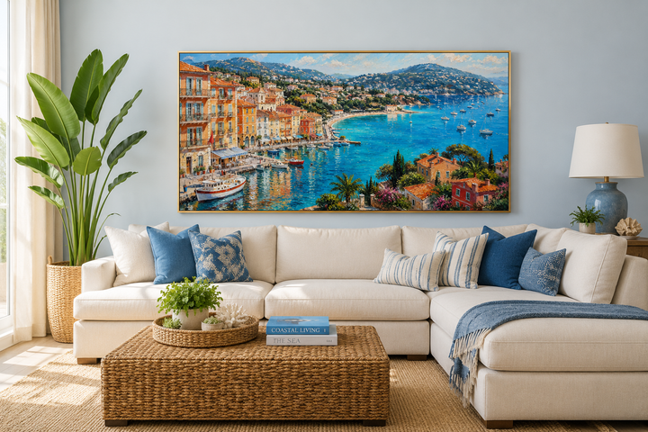 Cote d'Azur French Riviera painting of a coastal village harbor with sailboats above a white sofa.