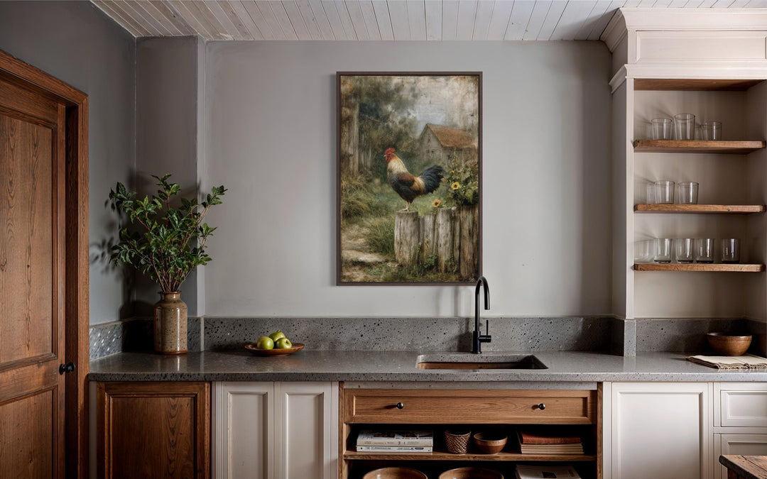 A vertical canvas print of a rooster on a wooden fence with a rustic barn landscape in a kitchen.
