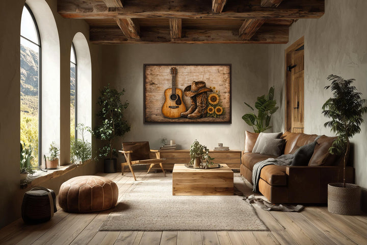 Cowboy boots, hat, guitar, and sunflowers canvas wall art in a rustic, sunlit living room.