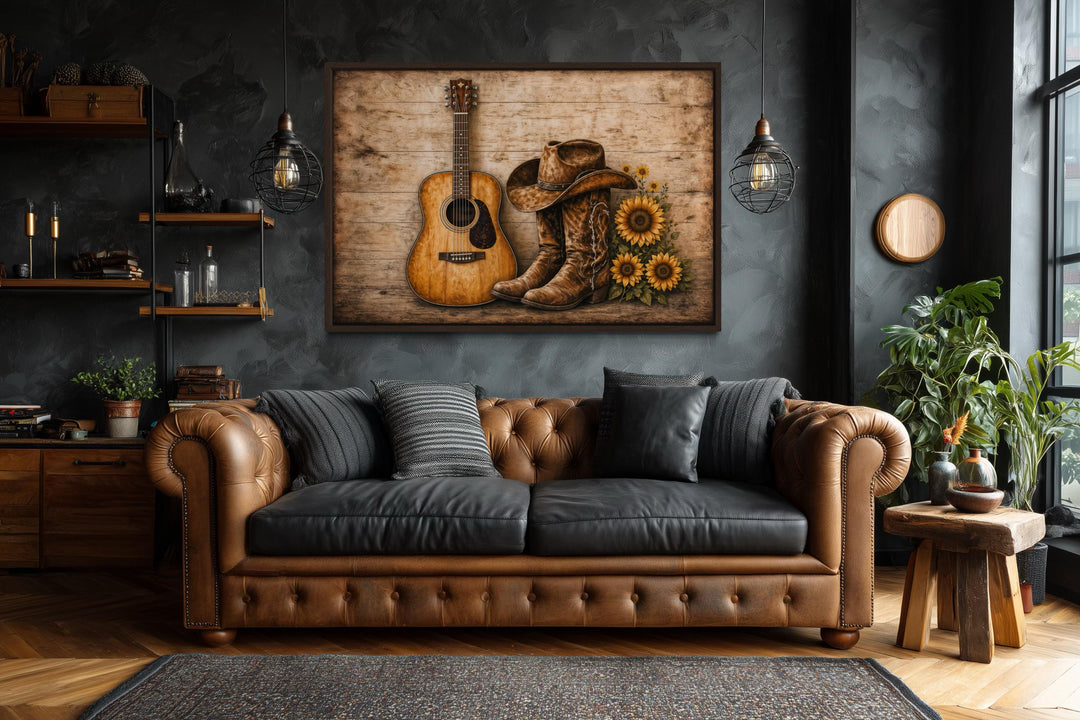 Rustic canvas wall art featuring a guitar, cowboy boots, and sunflowers in a dark, modern room.