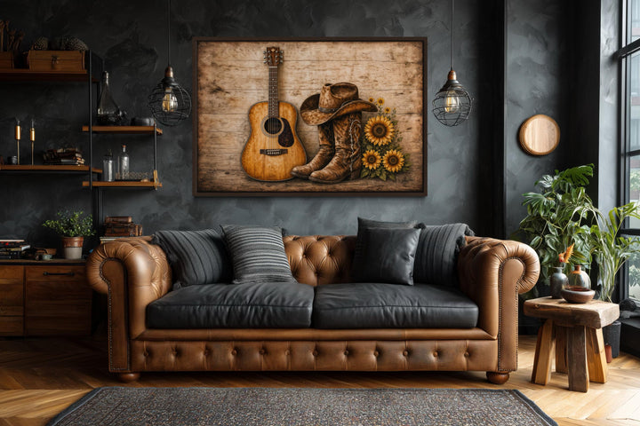 Rustic canvas wall art featuring a guitar, cowboy boots, and sunflowers in a dark, modern room.