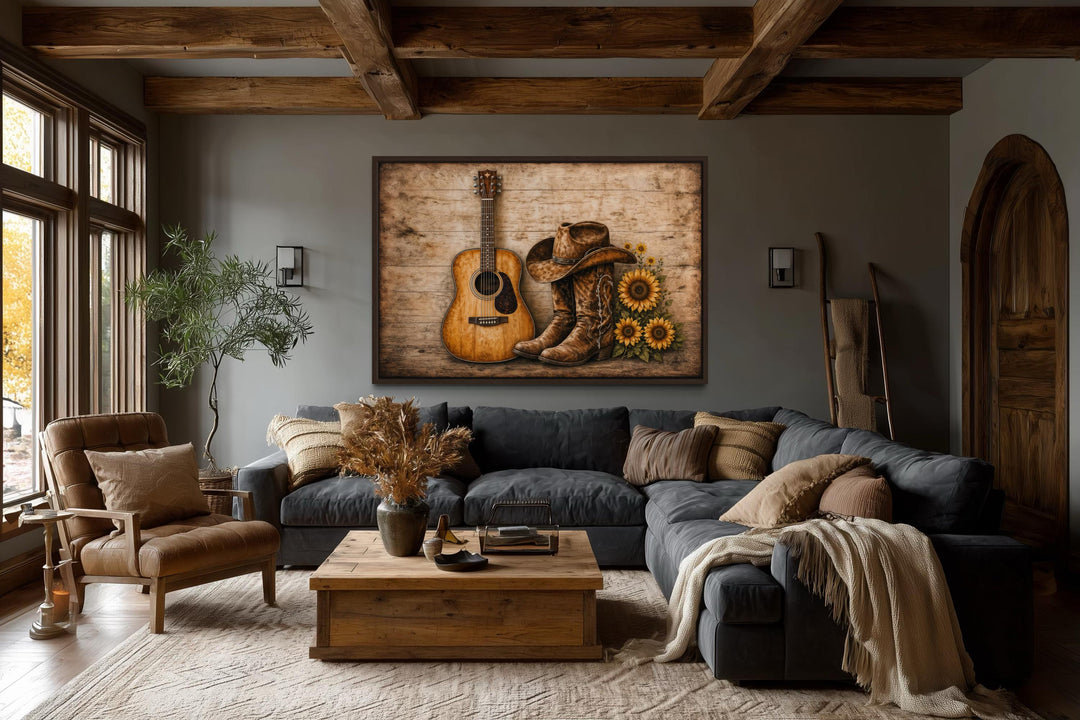 Rustic canvas wall art featuring a guitar, cowboy boots, hat, and sunflowers in a cozy living room.