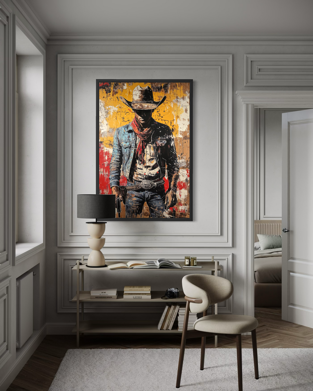 A framed canvas of a cowboy in a graffiti art style hangs in a modern, neutral-toned room.