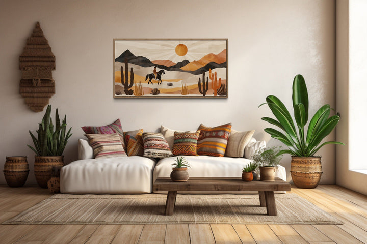 Cowboy in the desert framed canvas wall art in a neutral southwestern living room.