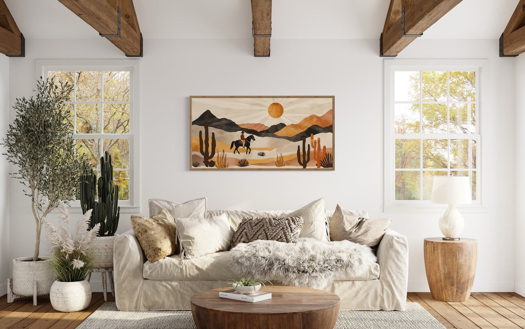 Cowboy in the desert framed canvas wall art in a neutral southwestern living room.
