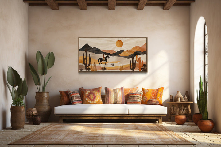 Cowboy in the desert framed canvas wall art in a southwestern style living room.