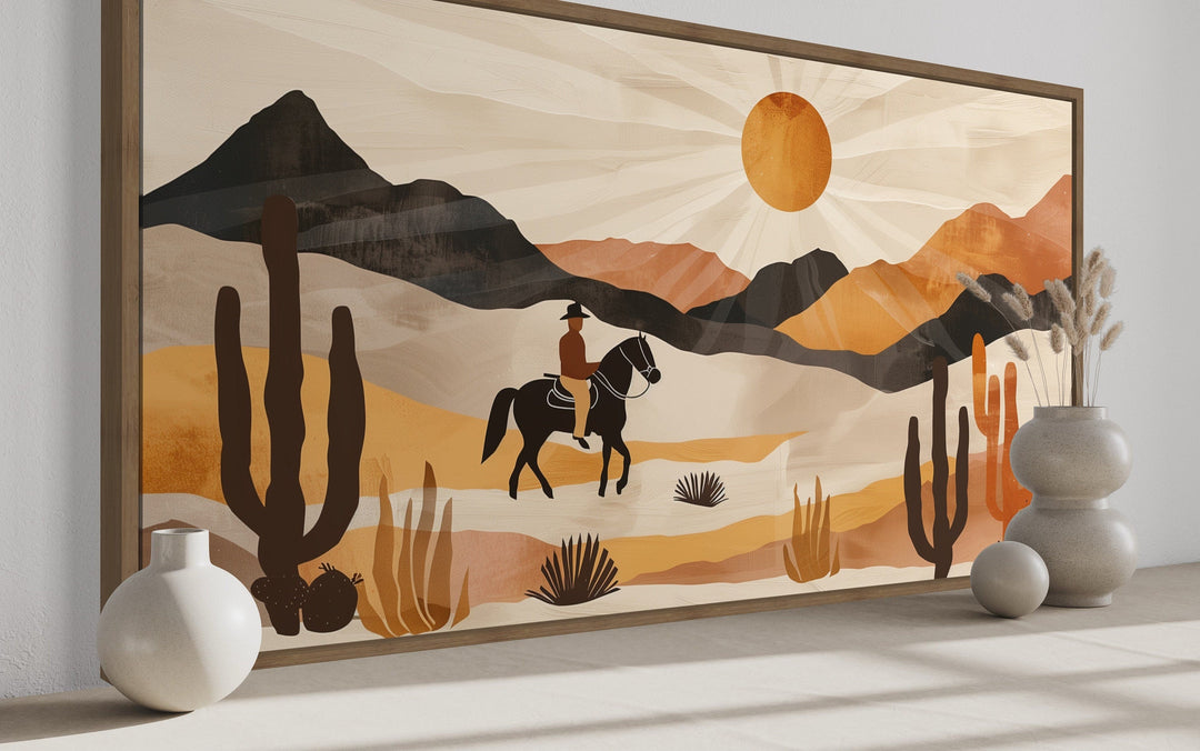 Cowboy on horseback in a neutral southwestern desert landscape framed canvas wall art.