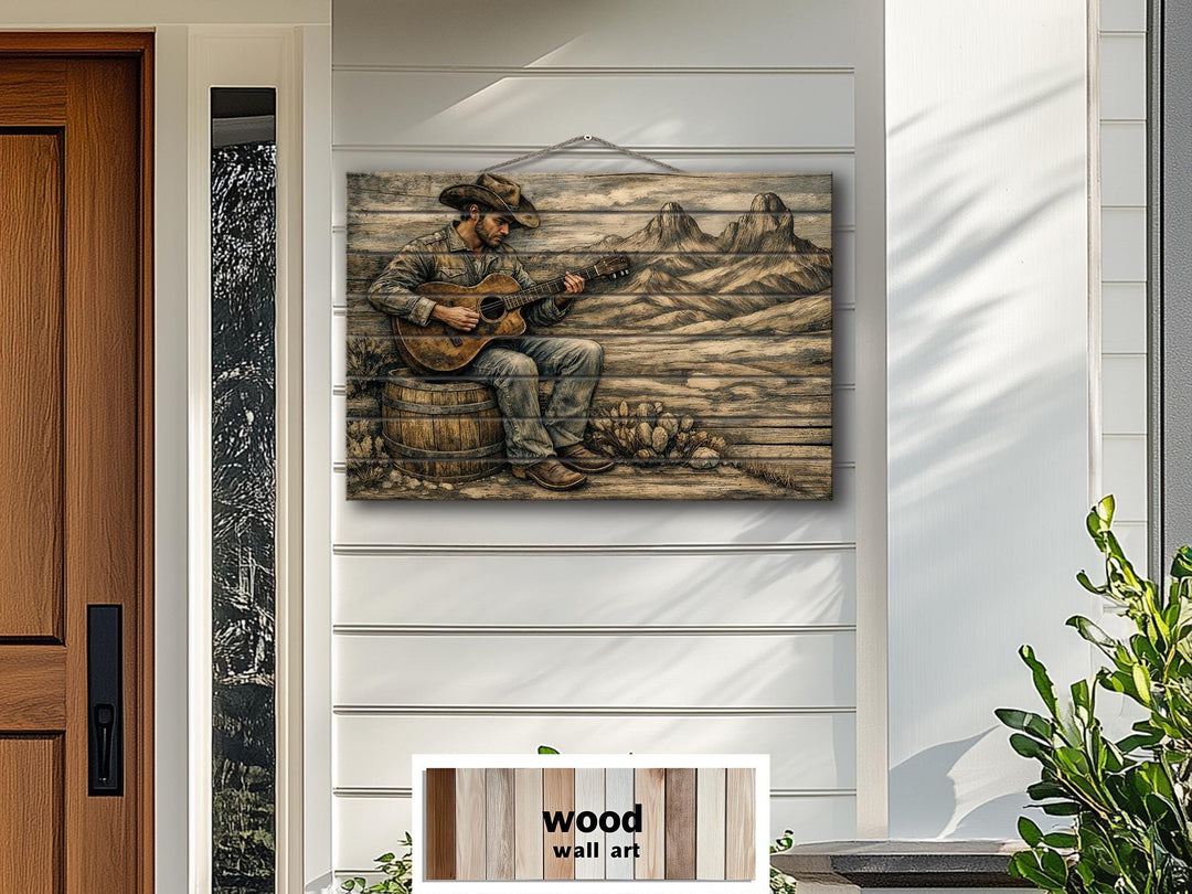 Rustic western wood wall art featuring a cowboy playing guitar on a distressed wood panel.