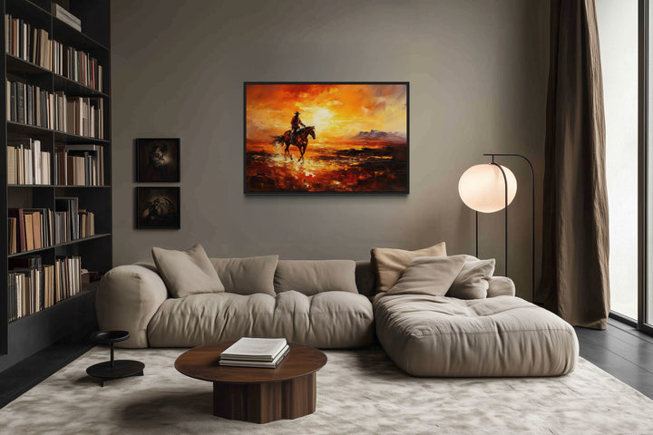 Cowboy riding a horse in the desert at sunset wild west canvas art in a modern living room.