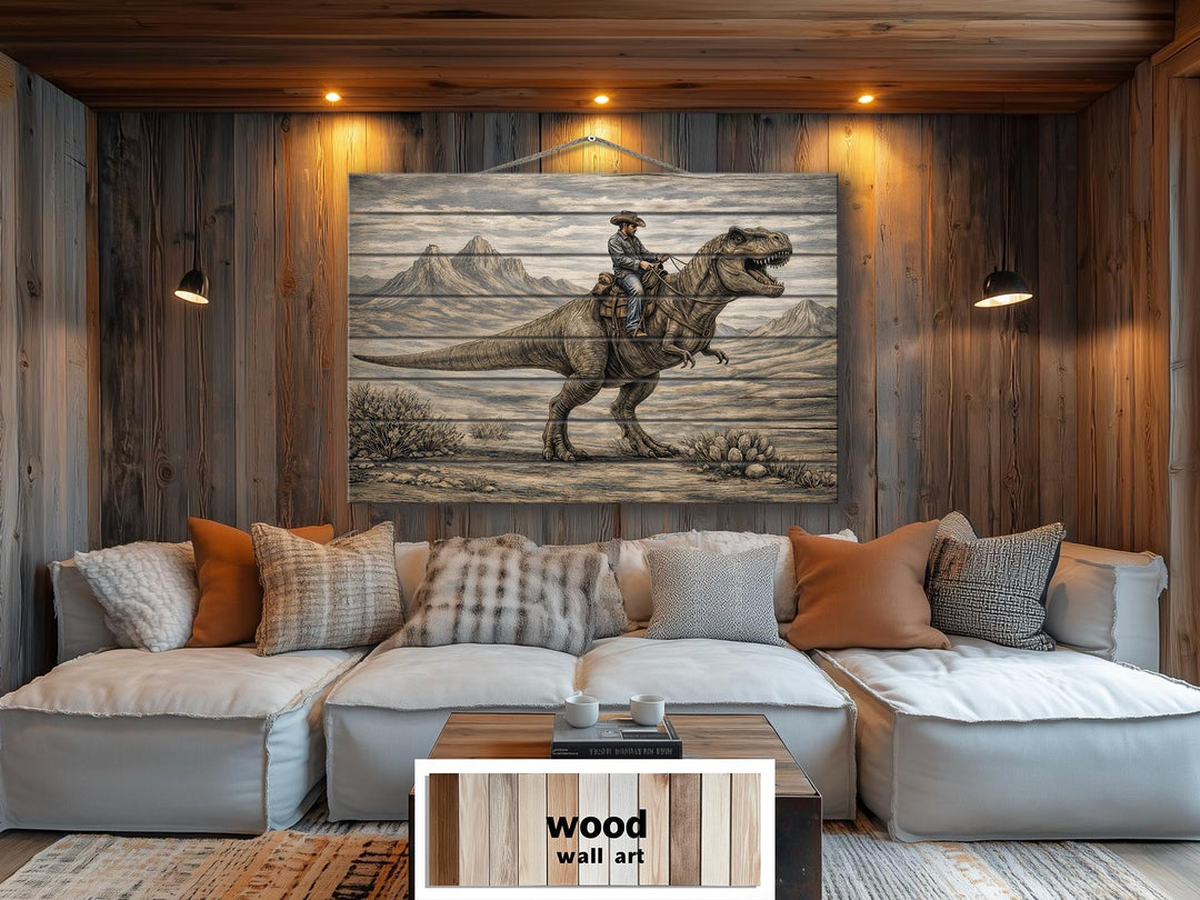 Rustic wood wall art featuring a cowboy riding a dinosaur above a white sectional sofa.