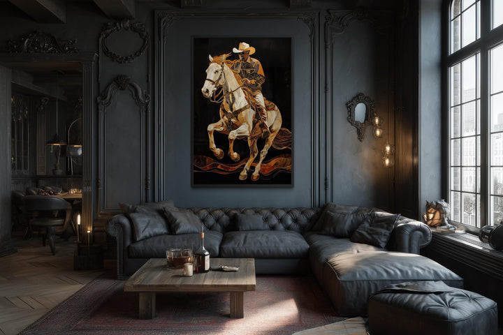 A vertical canvas painting of a cowboy on a rearing horse in a dark, moody living room.