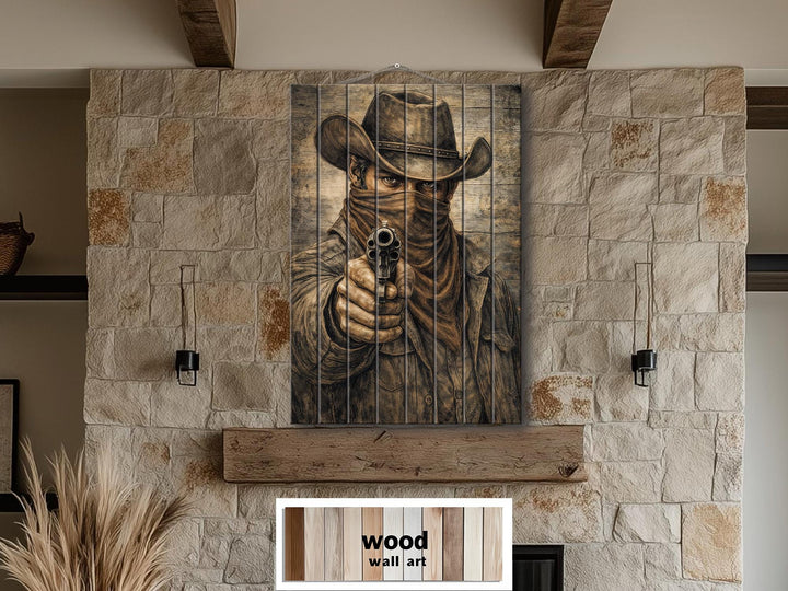 Distressed wood wall art featuring a cowboy outlaw portrait with a gun in a rustic room setting.