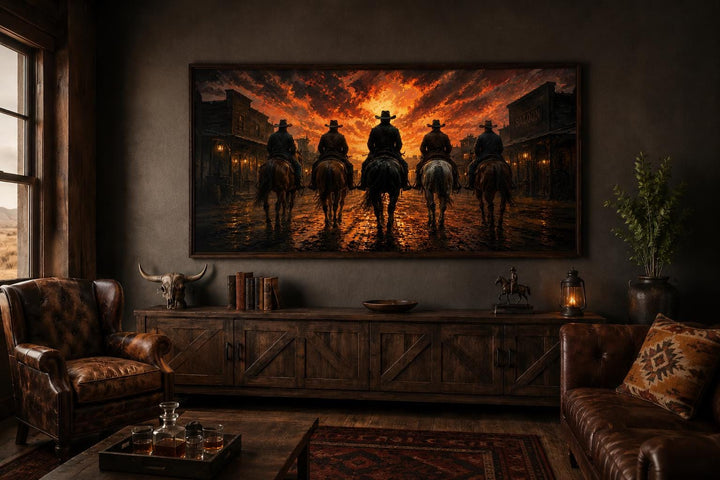 Cowboys riding into an old west town at sunset canvas print in a rustic living room setting.
