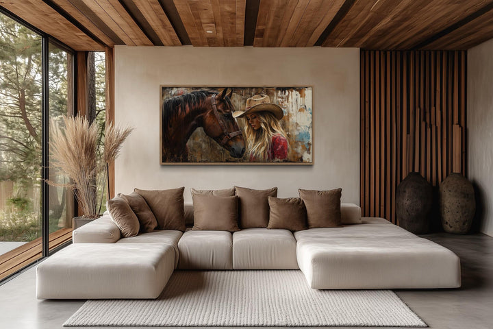 Cowgirl and horse graffiti framed canvas wall art in a modern rustic living room.