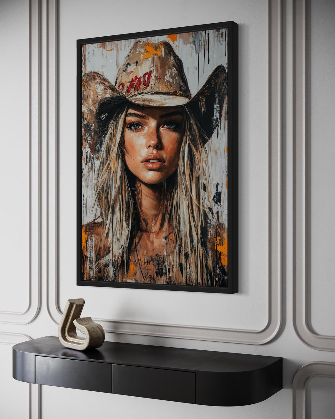 Cowgirl rustic graffiti portrait framed canvas wall art hanging above a black console table.