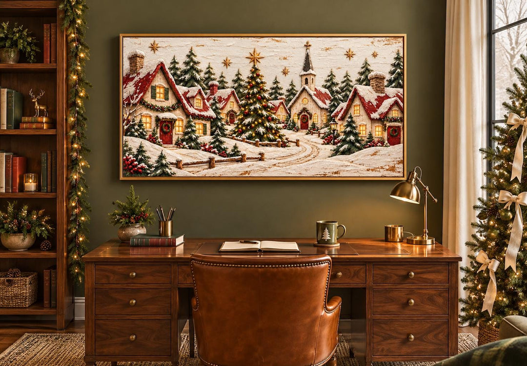 Cozy Christmas Village framed canvas wall art above a wooden desk in a festive home office.